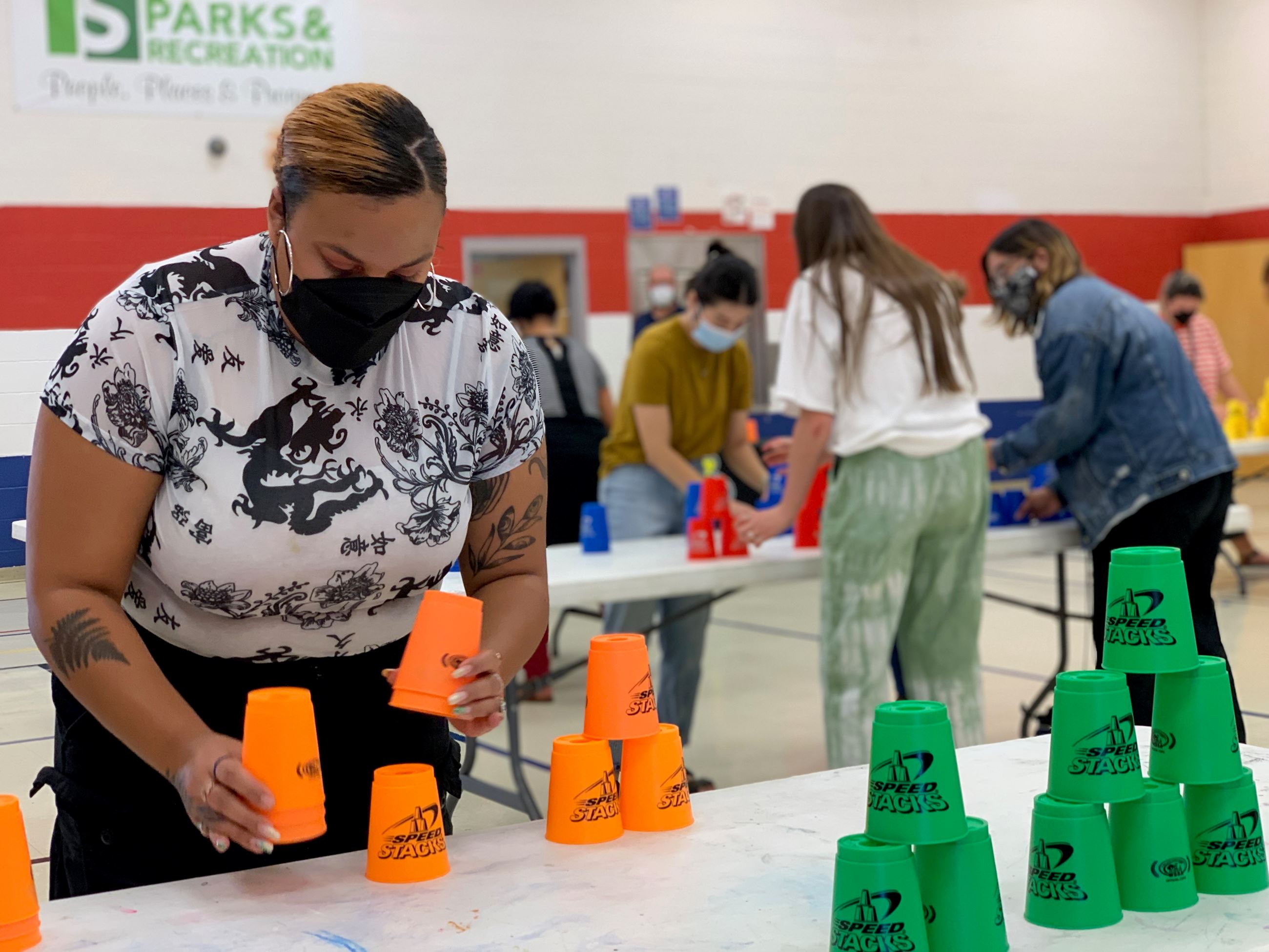 Woman stacking cups at event
